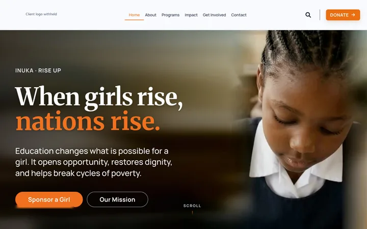 Nonprofit website home hero with navigation, a headline over a classroom photograph and two calls to action